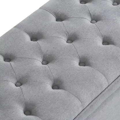 Banc de rangement capitonné en lin avec pieds en bois fuselés