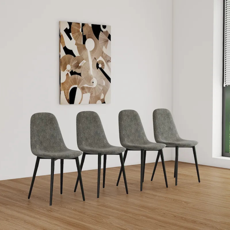 4 chaises de salle à manger avec assises en forme de cuillère et pieds en métal noir