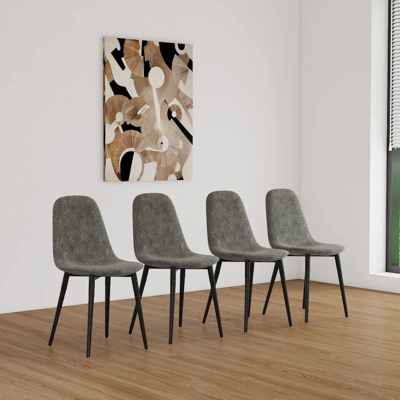 4 chaises de salle à manger avec assises en forme de cuillère et pieds en métal noir
