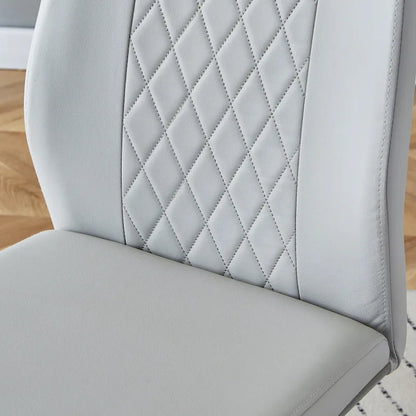 Ensemble table et chaises de salle à manger modernes en verre trempé avec piètement en forme de U à motif marbre et chaises rembourrées en PU