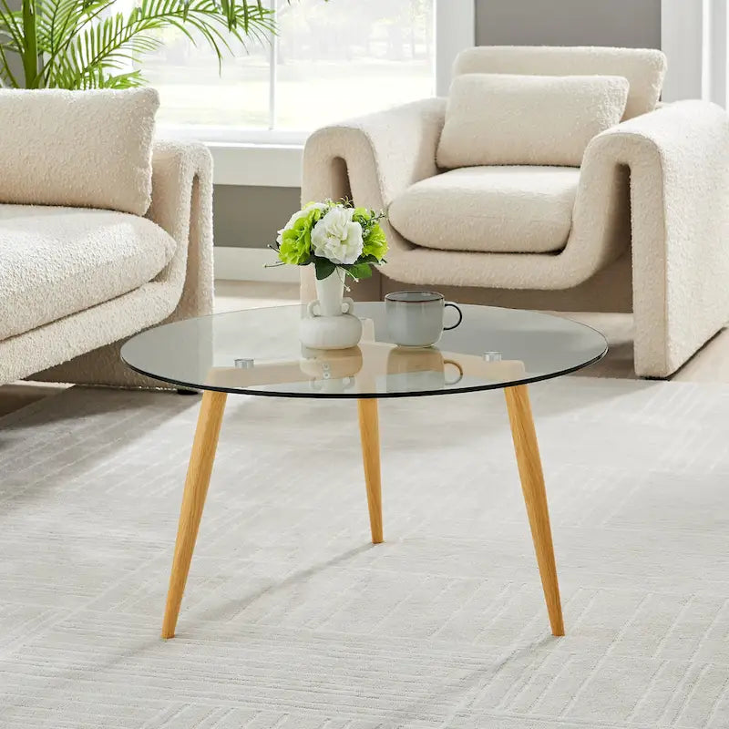 Table basse Danya B. Van Beuren avec pieds fuselés et plateau en verre