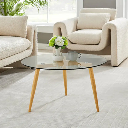 Table basse Danya B. Van Beuren avec pieds fuselés et plateau en verre