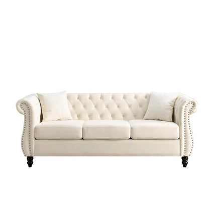 Canapé Chesterfield 3 places en velours beige, accoudoirs arrondis, finition cloutée