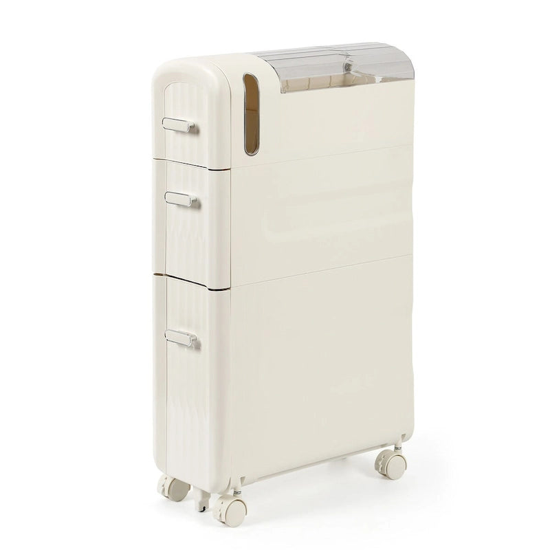 Armoire de rangement pour papier toilette à côté des toilettes, idéale pour les petites salles de bain.