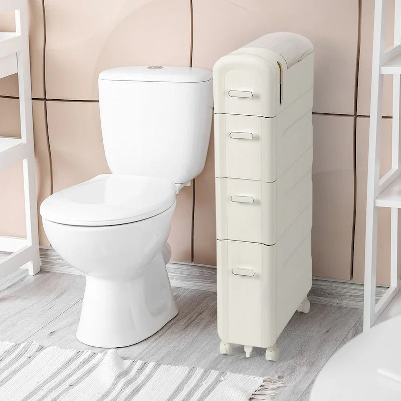 Armoire de rangement pour papier toilette à côté des toilettes, idéale pour les petites salles de bain.